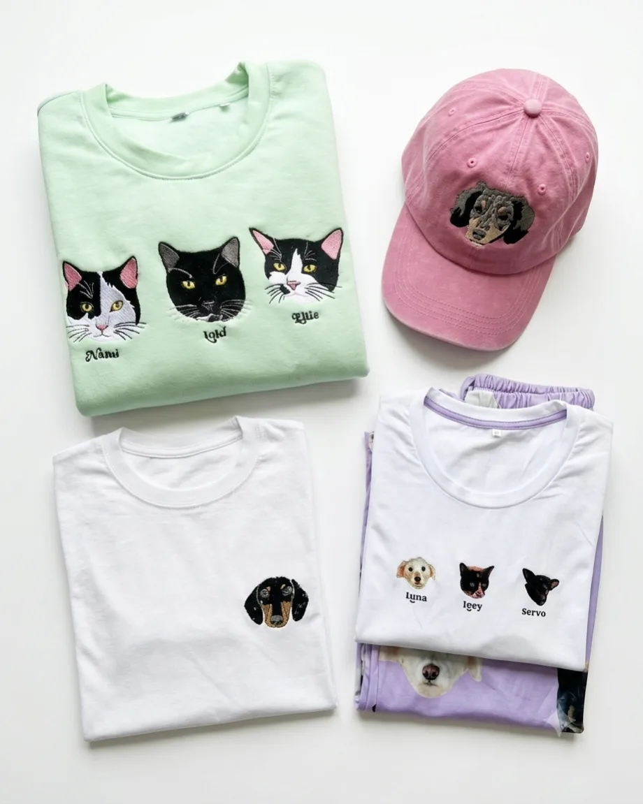 Prendas kustomizadas de catálogo: sudadera, camisetas y gorra bordadas con la cara de distintas mascotas
